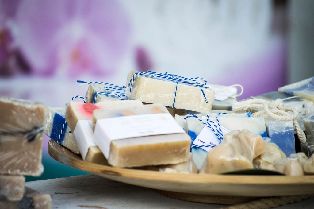 Bars of handmade soap on a wooden platter